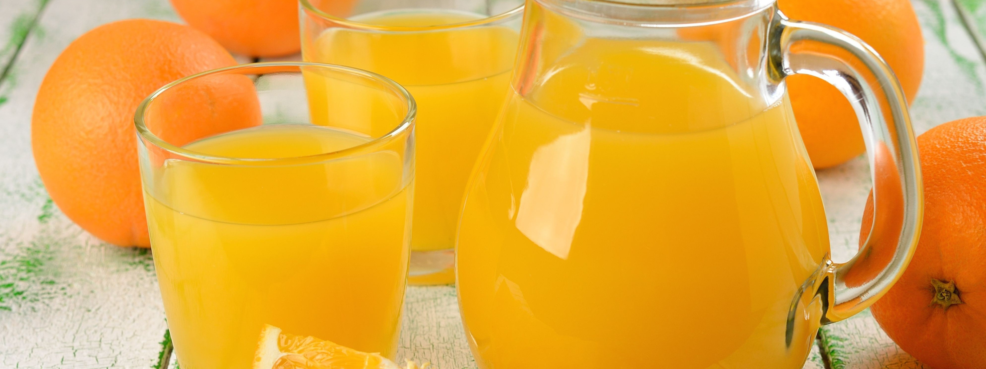 oranges, glasses, drink, pitcher, orange juice. 