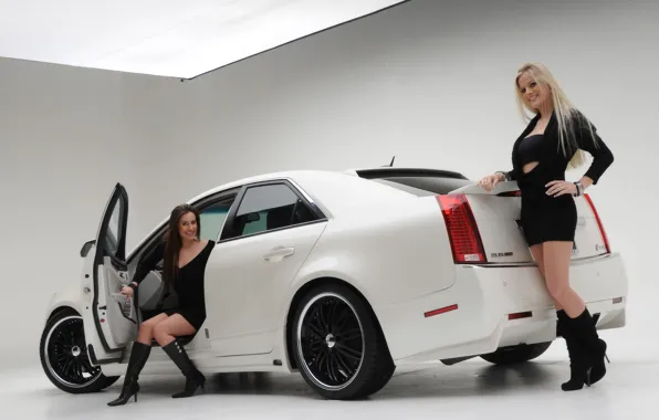 Picture Girls, blonde and brunette, two beautiful girls, cadillac cts 2008, brunette in the cabin, near …