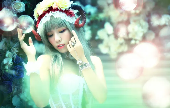 Picture flowers, horns, Oriental girl