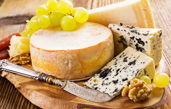 Picture cheese, grapes, knife, walnut