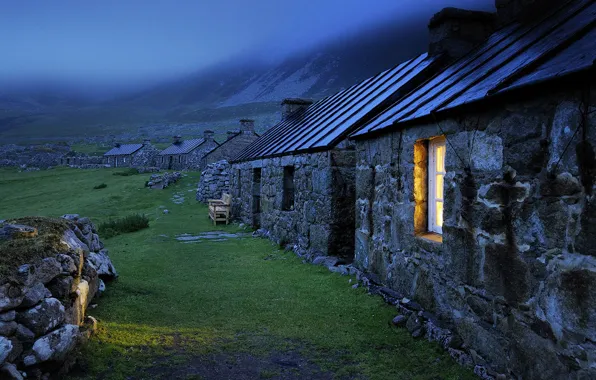 Picture light, grass, landscape, sunset, mountains, rocks, walls, evening, fog, window, stones, bench, lawn, Houses