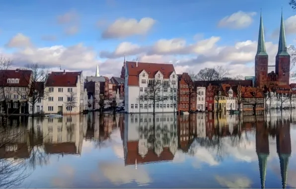 Picture the sky, water, clouds, trees, reflection, building, Europe, houses, town