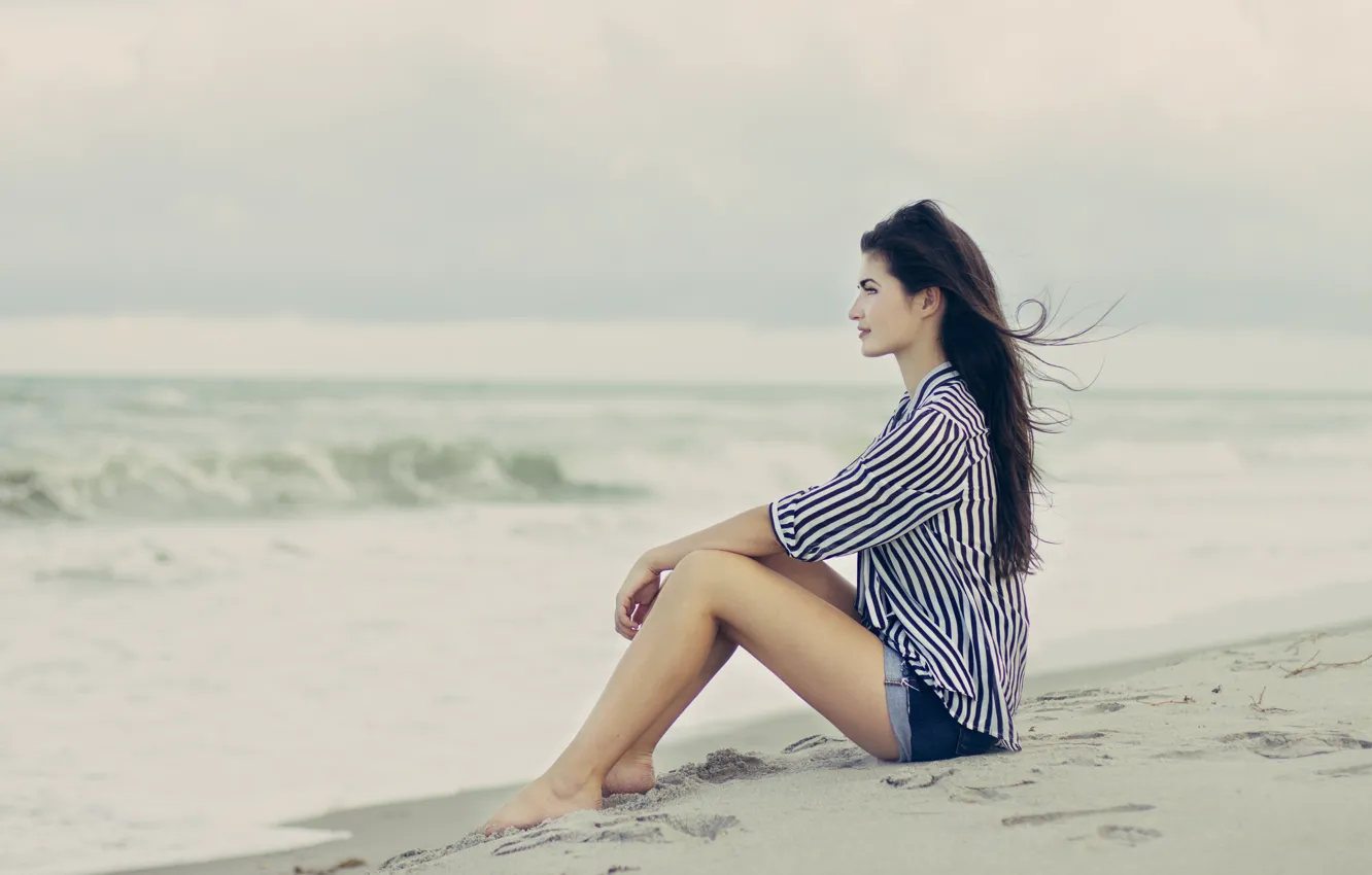 Photo wallpaper sand, beach, girl, pose, the wind, brunette, profile, sitting