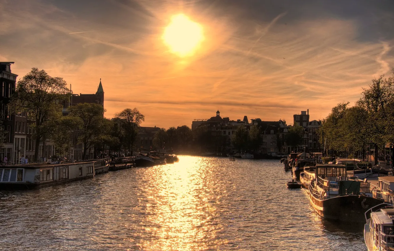 Photo wallpaper the sun, sunset, river, home, boats, Amsterdam, Sun over